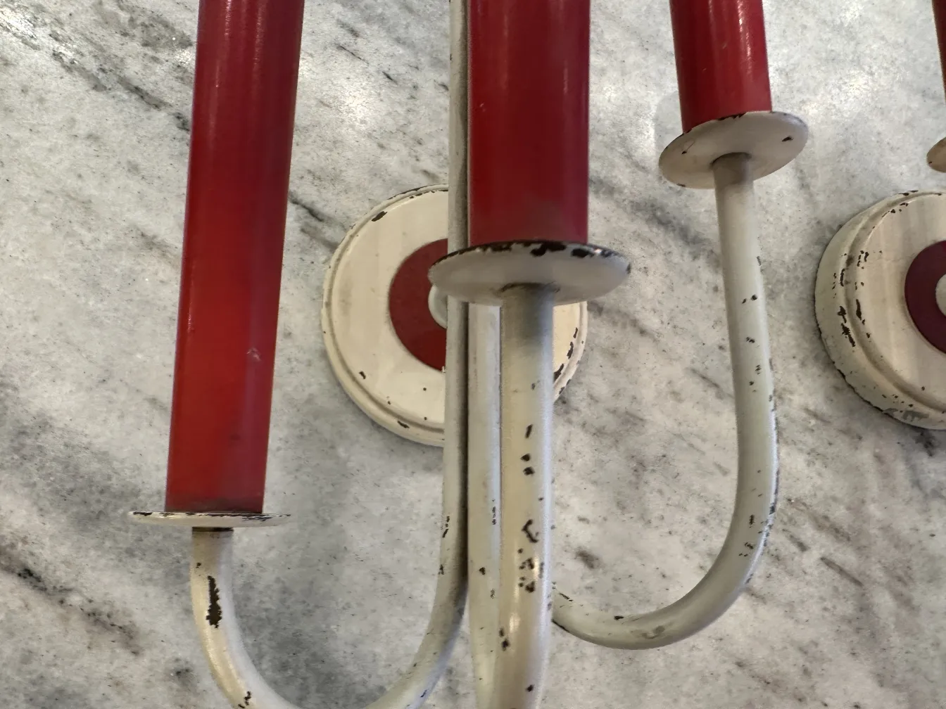 Antique pair of sconces with red candles and white base, in Jean royère style