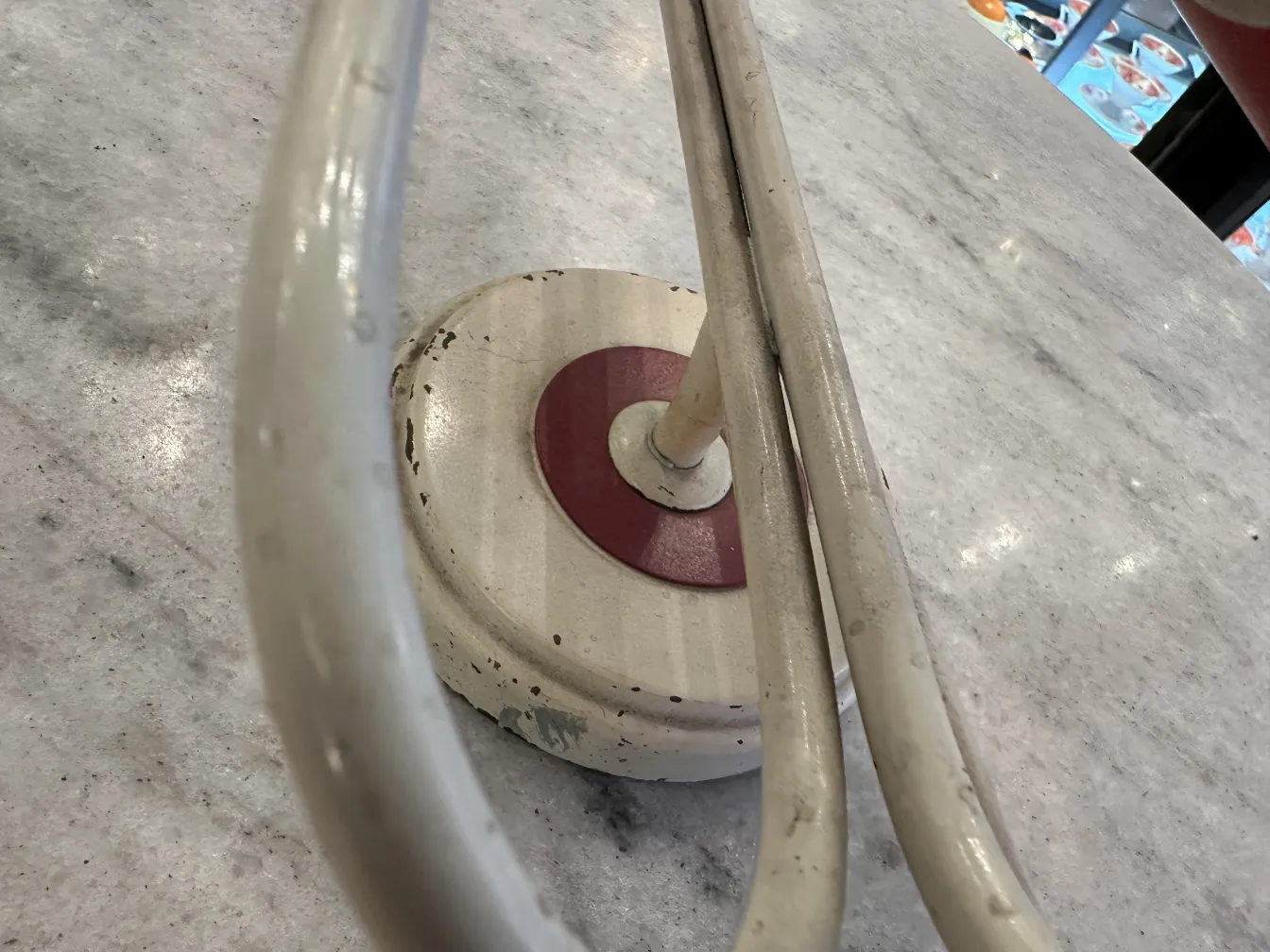 antique sconces with curved design and round base