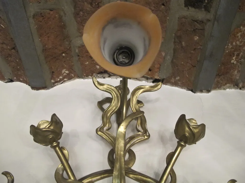 sconces with floral design in a classic setting