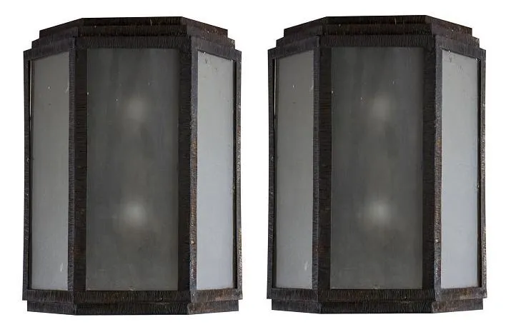 Pair of antique sconces featuring a rectangular design and dark color.