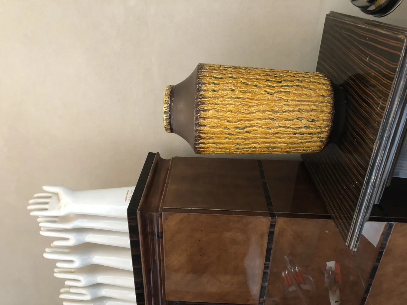 Antique decorative ceramic vase with yellow and brown texture