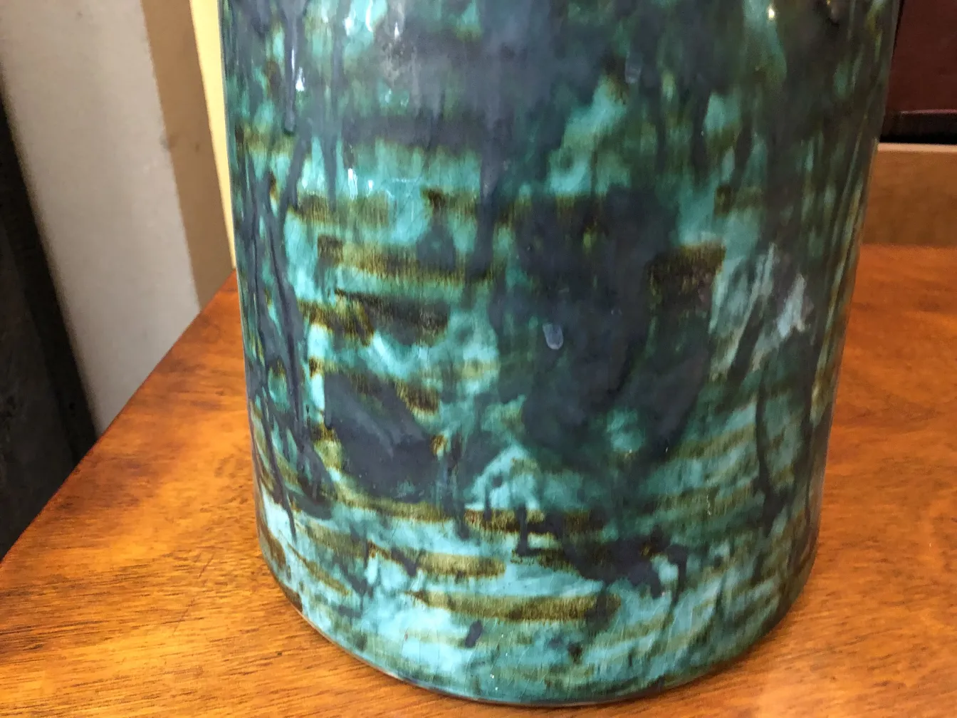 antique ceramic piece in blue and green, featuring unique texture