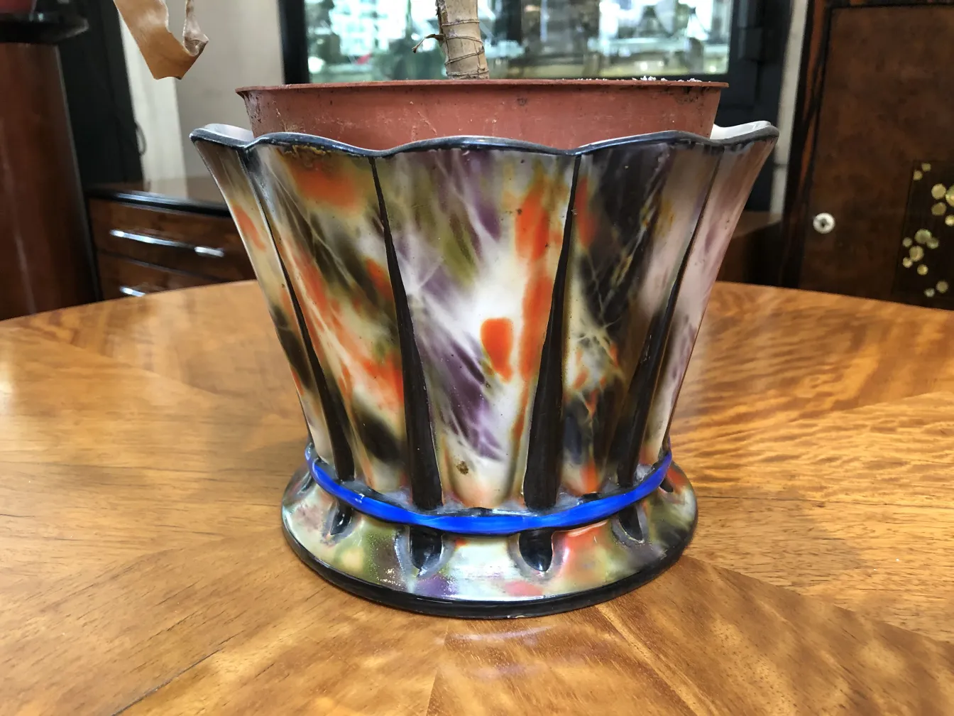 decorative antique ceramic pot with vibrant colors.