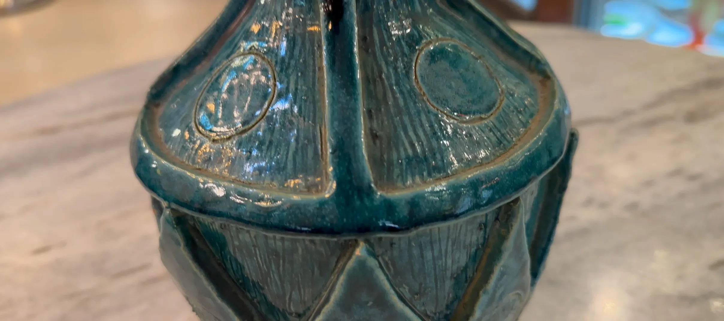 Antique decorative ceramic teapot in blue and green.