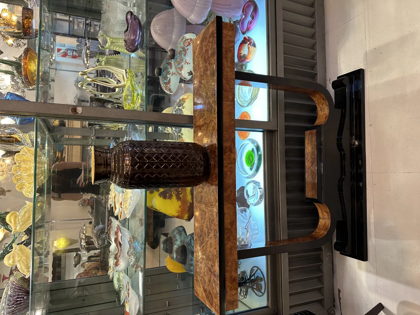 antique ceramic vase with textured design in a varied antique environment