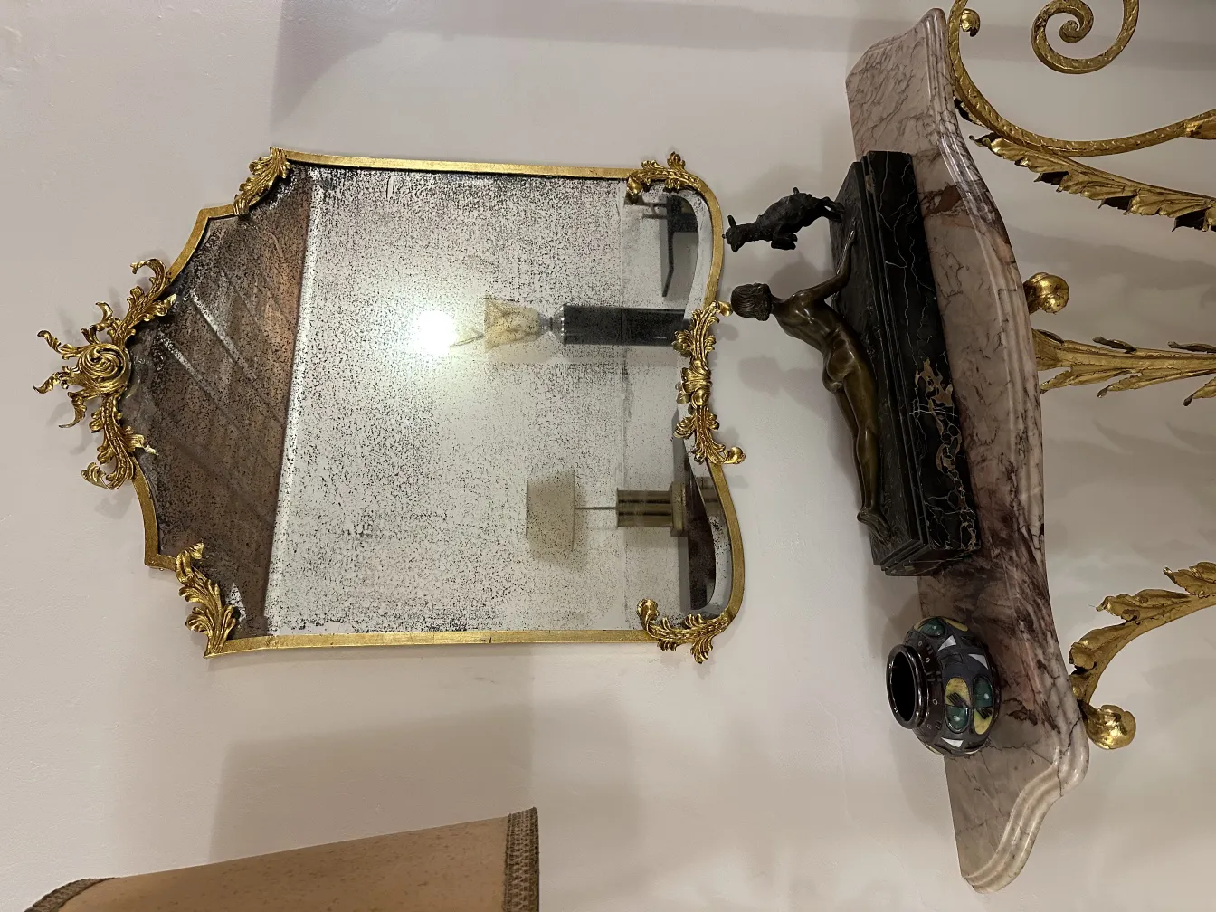 Antique decorative mirror with ceramic and gold.