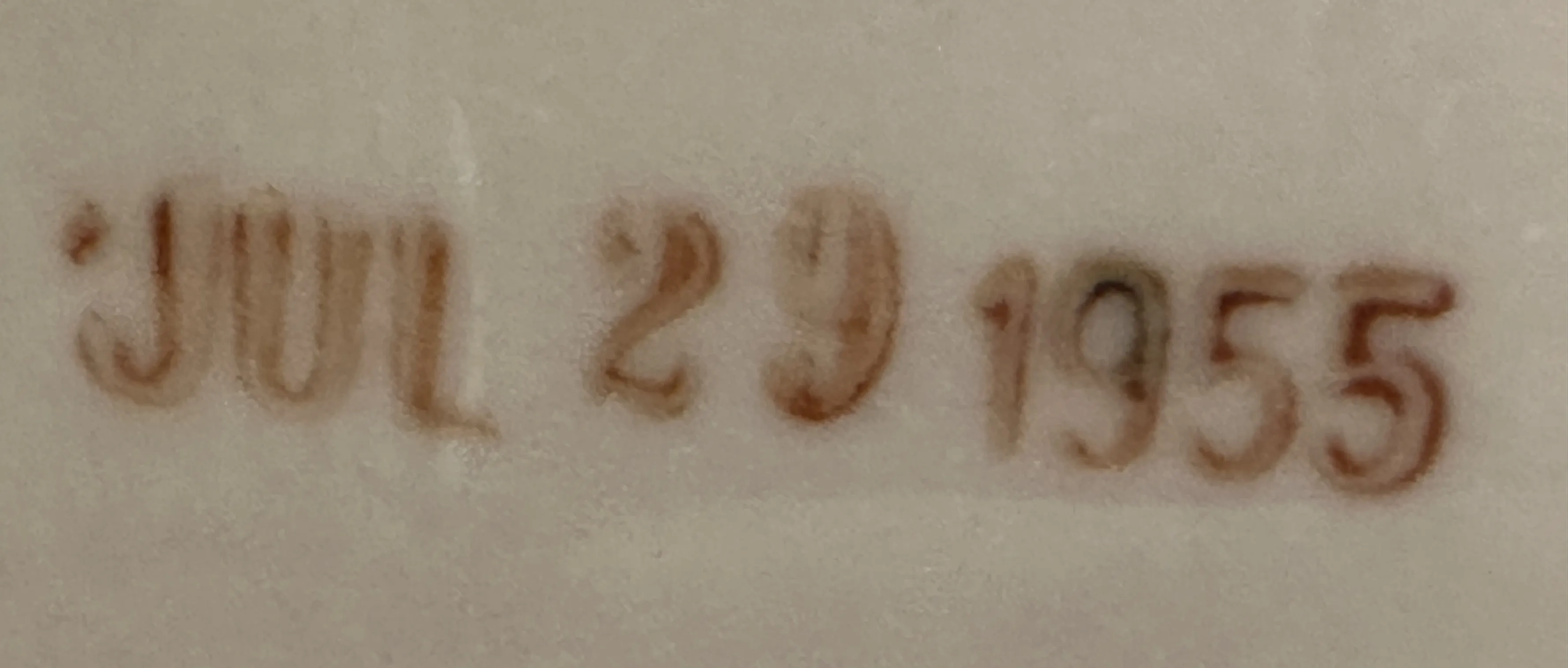 sello antiguo con inscripción jul 29 1955 en un fondo claro